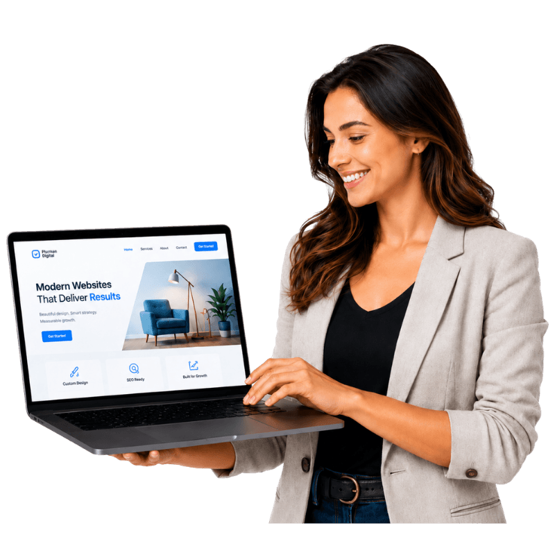 Woman smiling while working on a laptop showing a Plamann Digital website